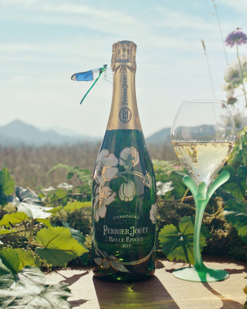 Belle Epoque Brut bottle in nature with flowers and a flute