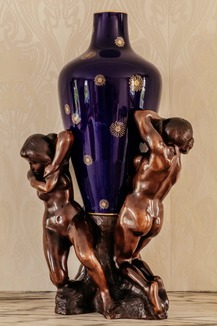 Group of three women supporting a Sèvres porcelain vase by François-Rupert Carabin