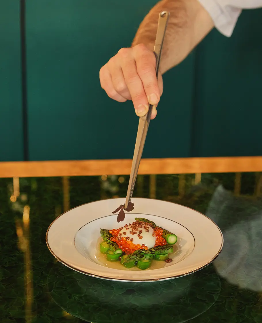 CBE Cellier Belle Epoque - Food Pairing Menu - A chef dressing a plate