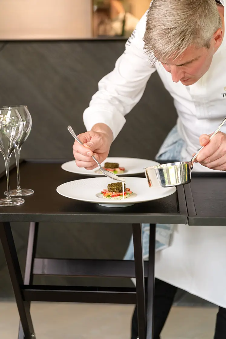 Tim Boury dressing a dish